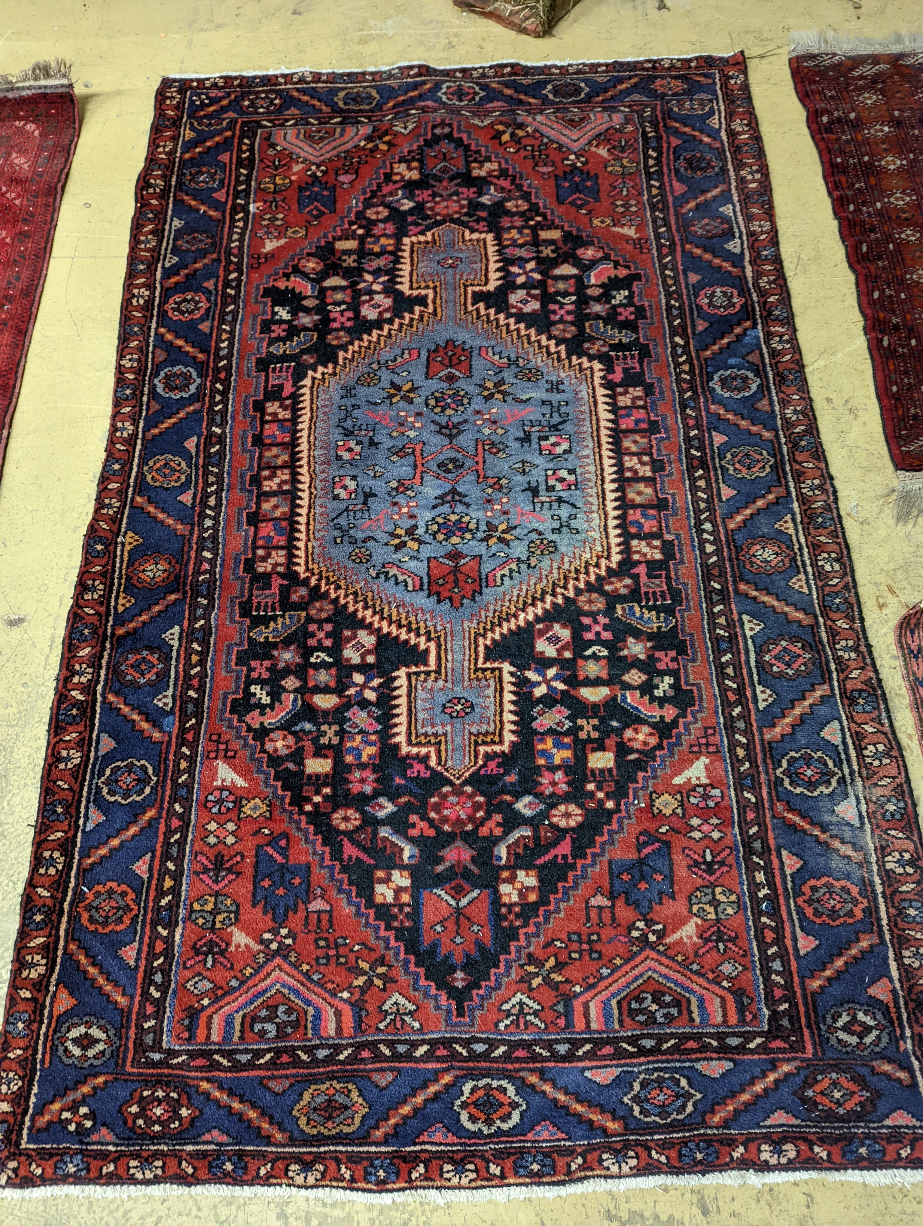 A Hamadan blue ground floral rug and a smaller Caucasian design blue ground rug, larger 210 x 130cm